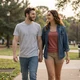 Young couple walking at an Atlanta park - trucker dating success