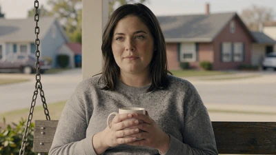 Woman with coffee on a porch swing - maintaining relationships during long hauls