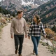 Tyler and Haley walking near a Wyoming mountain trailhead - trucker dating success