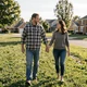 David and Lisa, a happy couple walking in a park - trucker dating success