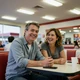 Robert and his wife at a truck stop diner - Nebraska trucker marriage success