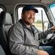 Mike, OTR truck driver smiling in his cab - DriveMatch success story