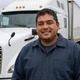 Carlos, Chicago truck driver smiling by his truck - DriveMatch success story