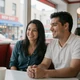 Carlos and his partner smiling at a New York diner - trucker dating success story