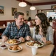 Robert and Jennifer sharing a meal at a diner - trucker dating LA success