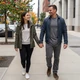 Chris and Emily holding hands walking in Chicago - trucker dating success
